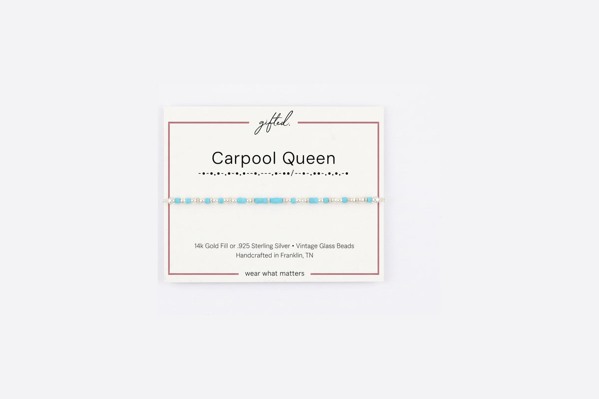 Carpool queen spelled in Morse code in glass and metal beads on a gifted. card.