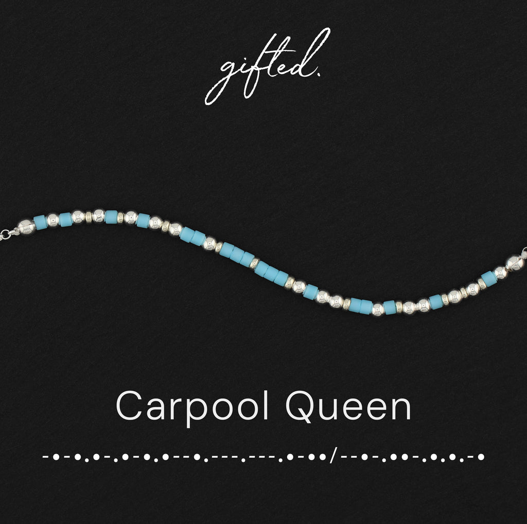 Carpool queen spelled in Morse code in glass and metal beads, shown on black