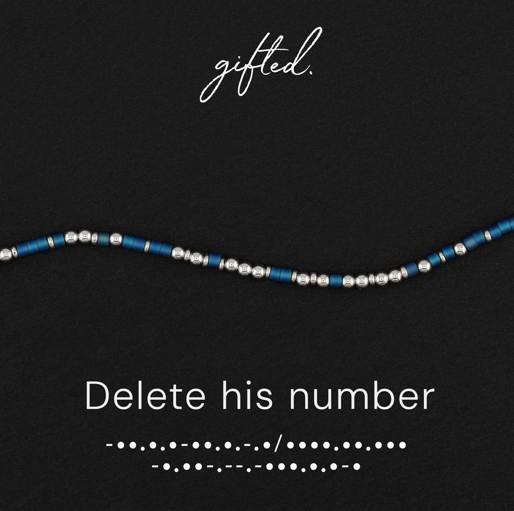 Delete his number spelled in Morse code in glass and metal beads, shown on black
