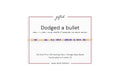 Dodged a bullet spelled in Morse code in glass and metal beads on a gifted. card.