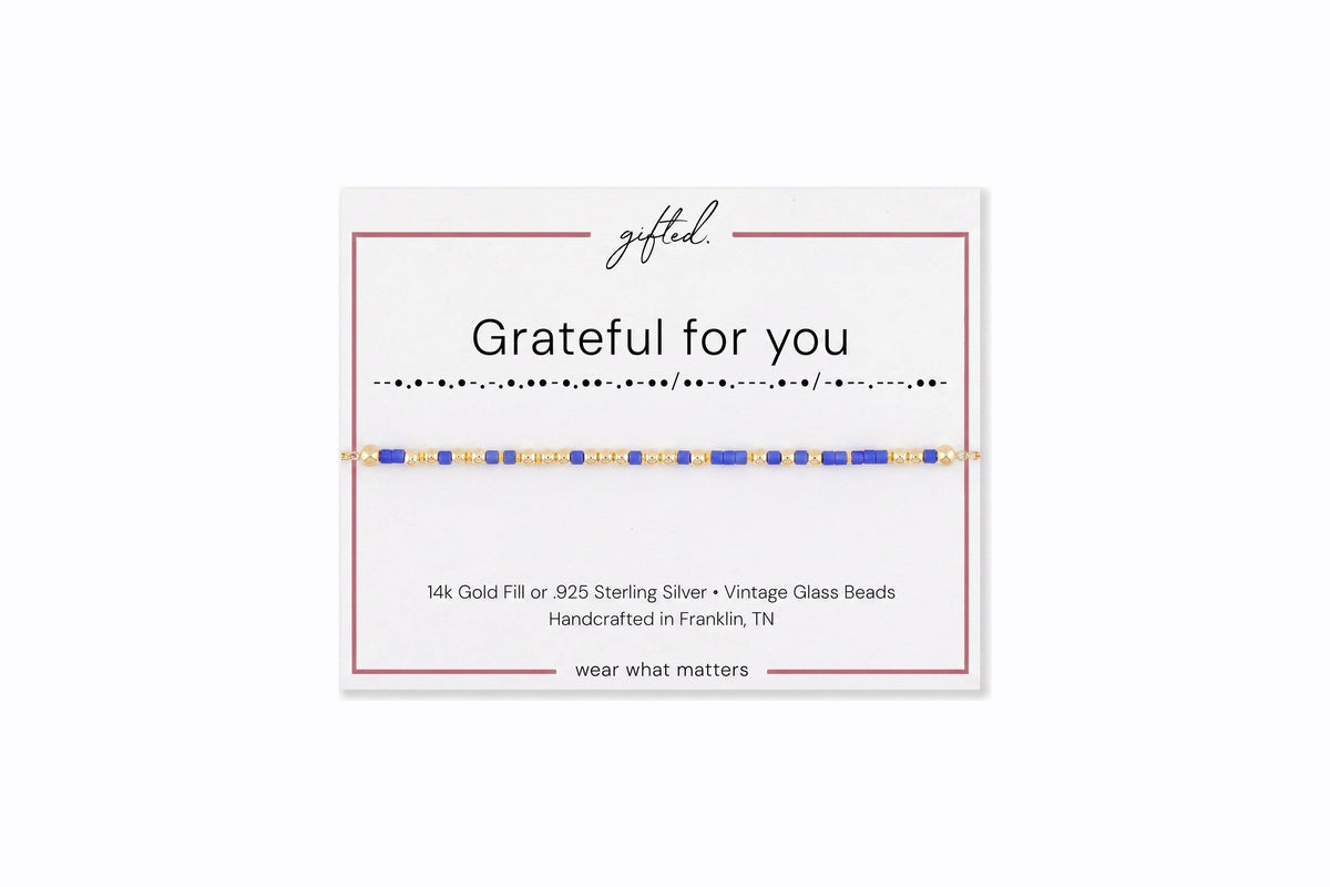 Grateful for you spelled in Morse code in glass and metal beads on a gifted. card.
