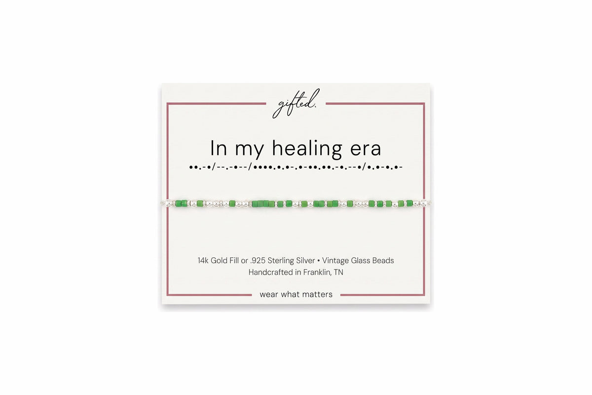 In my healing era spelled in Morse code in glass and metal beads on a gifted. card.