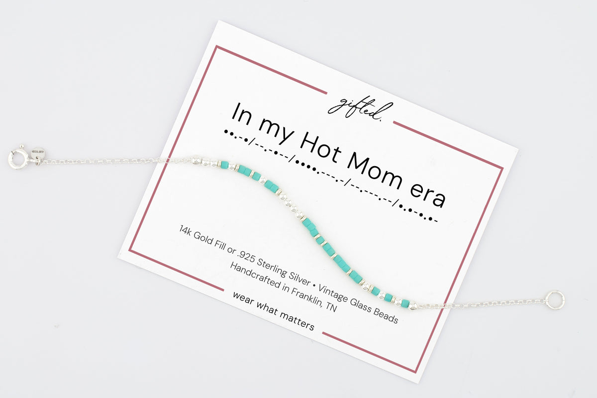 In my hot mom era on its printed gifted. card, with the Morse line and the materials named