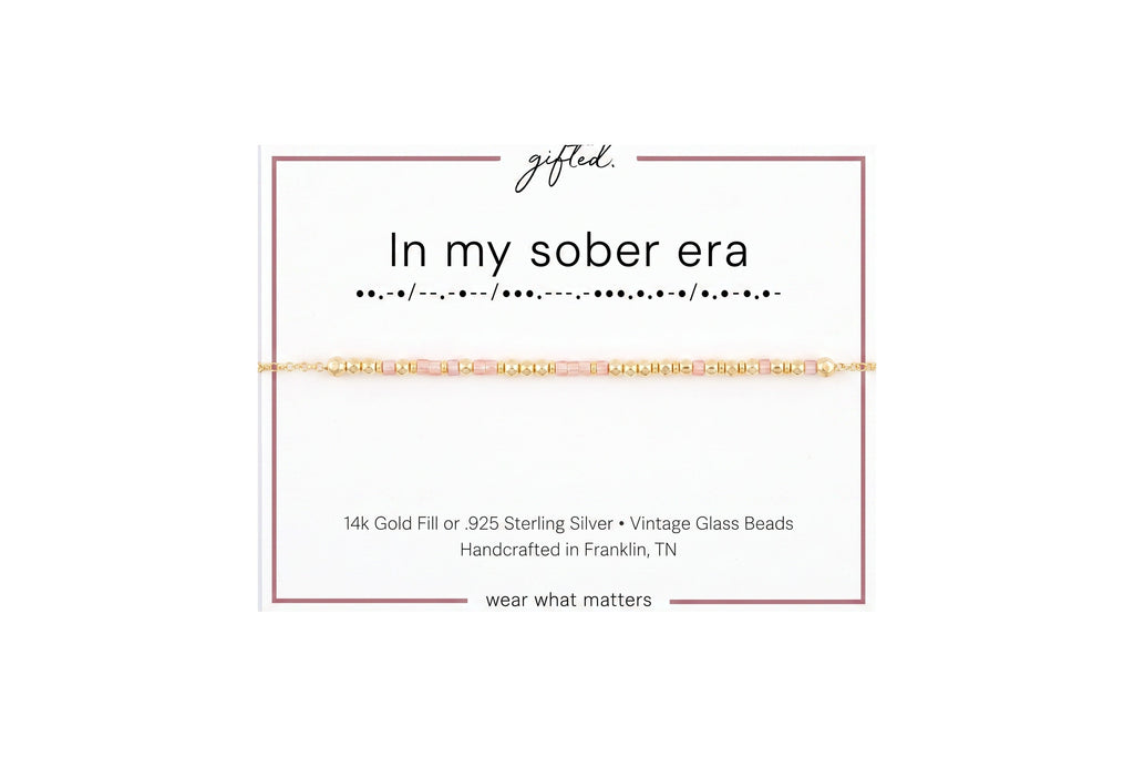 In my sober era spelled in Morse code in glass and metal beads on a gifted. card.