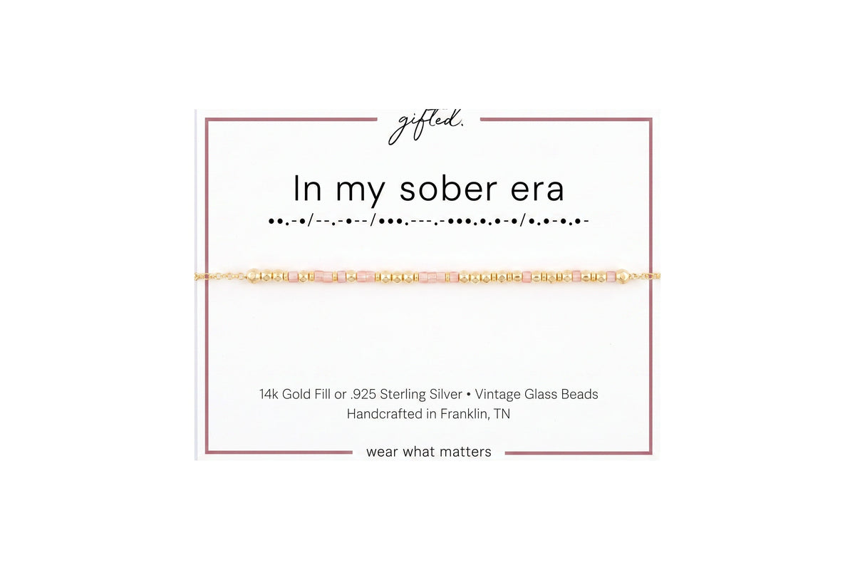 In my sober era spelled in Morse code in glass and metal beads on a gifted. card.