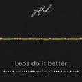 Leos do it better spelled in Morse code in glass and metal beads, shown on black