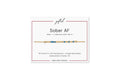 Sober AF spelled in Morse code in glass and metal beads on a gifted. card.