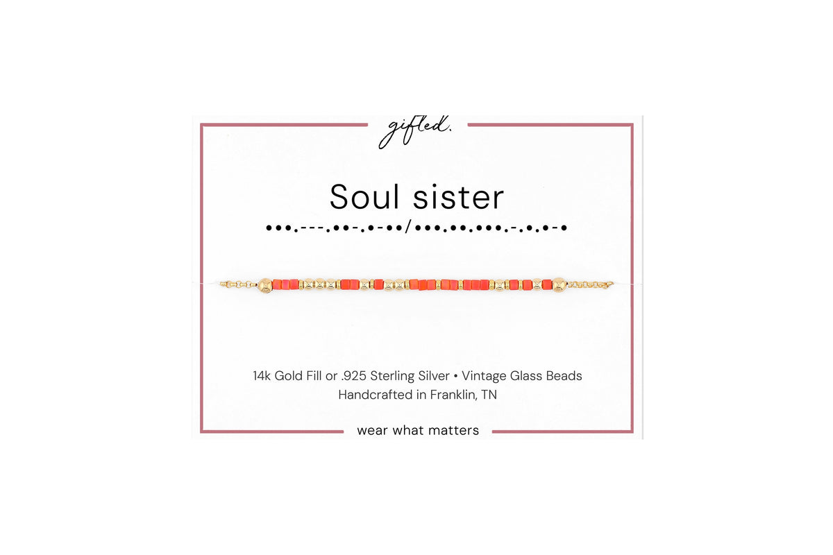 Soul sister spelled in Morse code in glass and metal beads on a gifted. card.