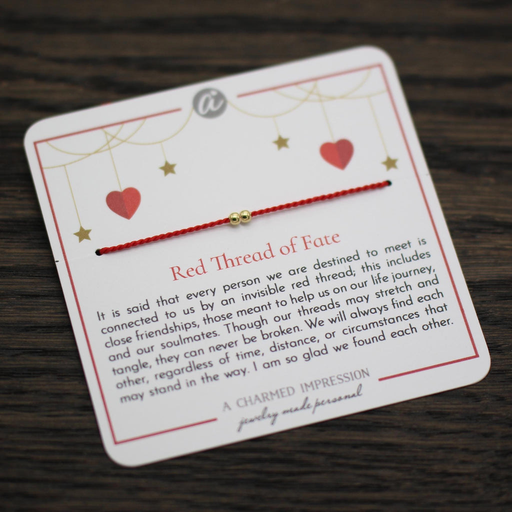 Red thread of fate on message card. 14k Gold Fill.