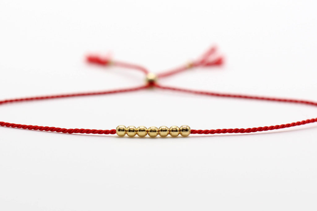 Red thread of fate on message card. 14k Gold Fill or Sterling Silver Beads.