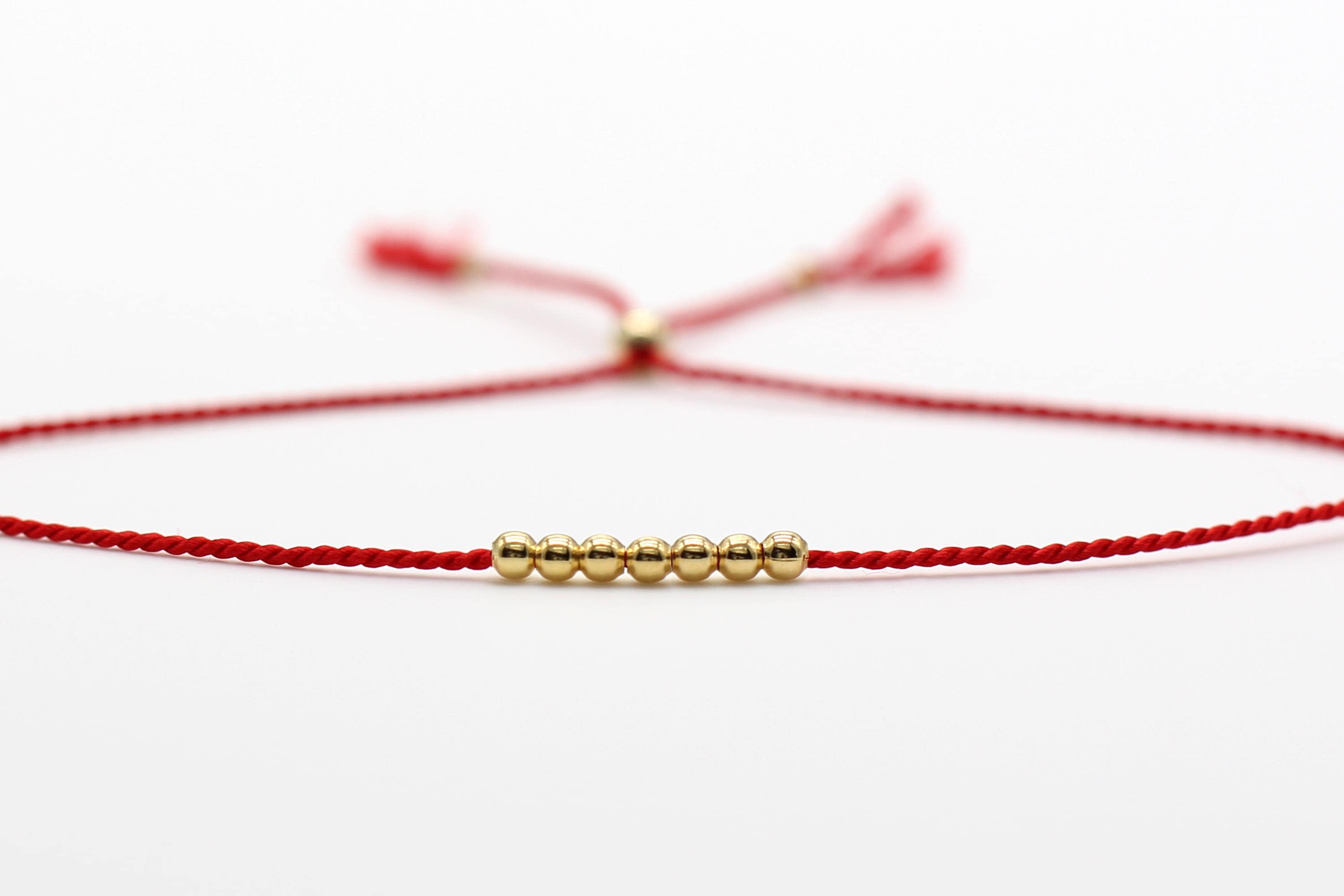 Red thread of fate on message card. 14k Gold Fill or Sterling Silver Beads.