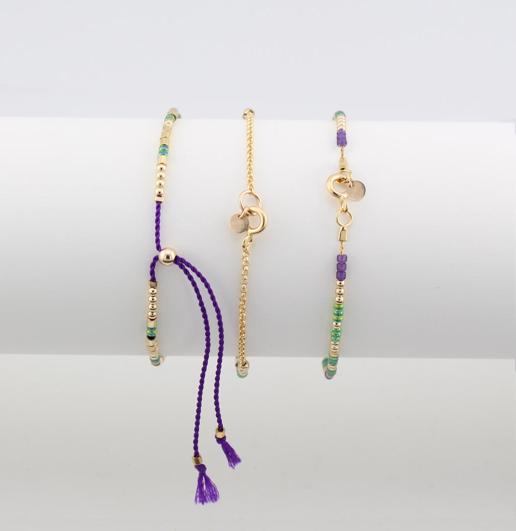 Three morse code bracelets side by side showing silk cord and chain closures