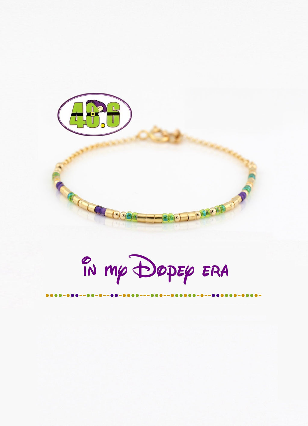 14k gold fill morse code bracelet in green and purple glass beads, shown with the 48.6 Dopey logo and the phrase in my Dopey era