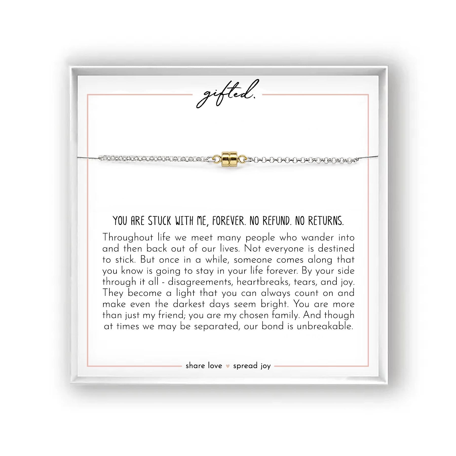 May include: A silver chain bracelet with a gold-colored cylindrical bead. The bracelet is presented on a white card with the word "gifted" and a message about enduring friendship. The card is in a white box.