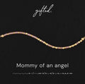 Mommy of an Angel spelled in Morse code in glass and metal beads, shown on black