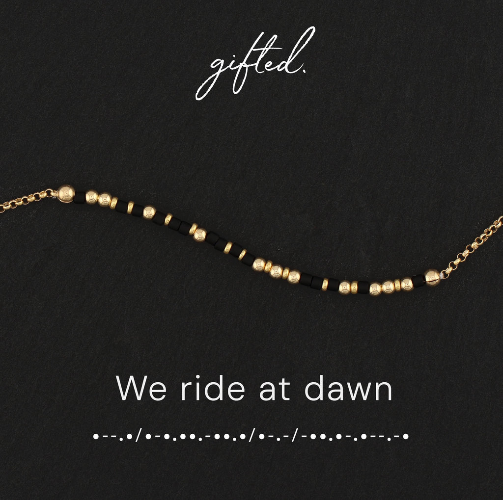 We ride at dawn spelled in Morse code in beads on a gifted. card