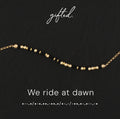 We ride at dawn spelled in Morse code in beads on a gifted. card