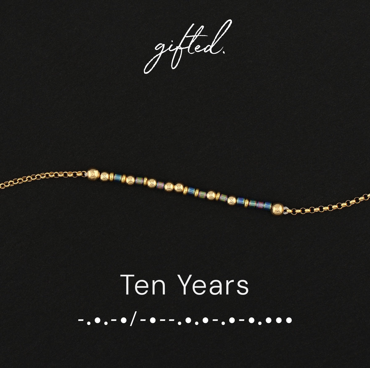 Ten Years spelled in Morse code in glass and metal beads, shown on black
