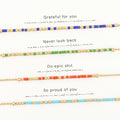 Four Morse code bracelets shown with their phrases and the dots and dashes that spell them
