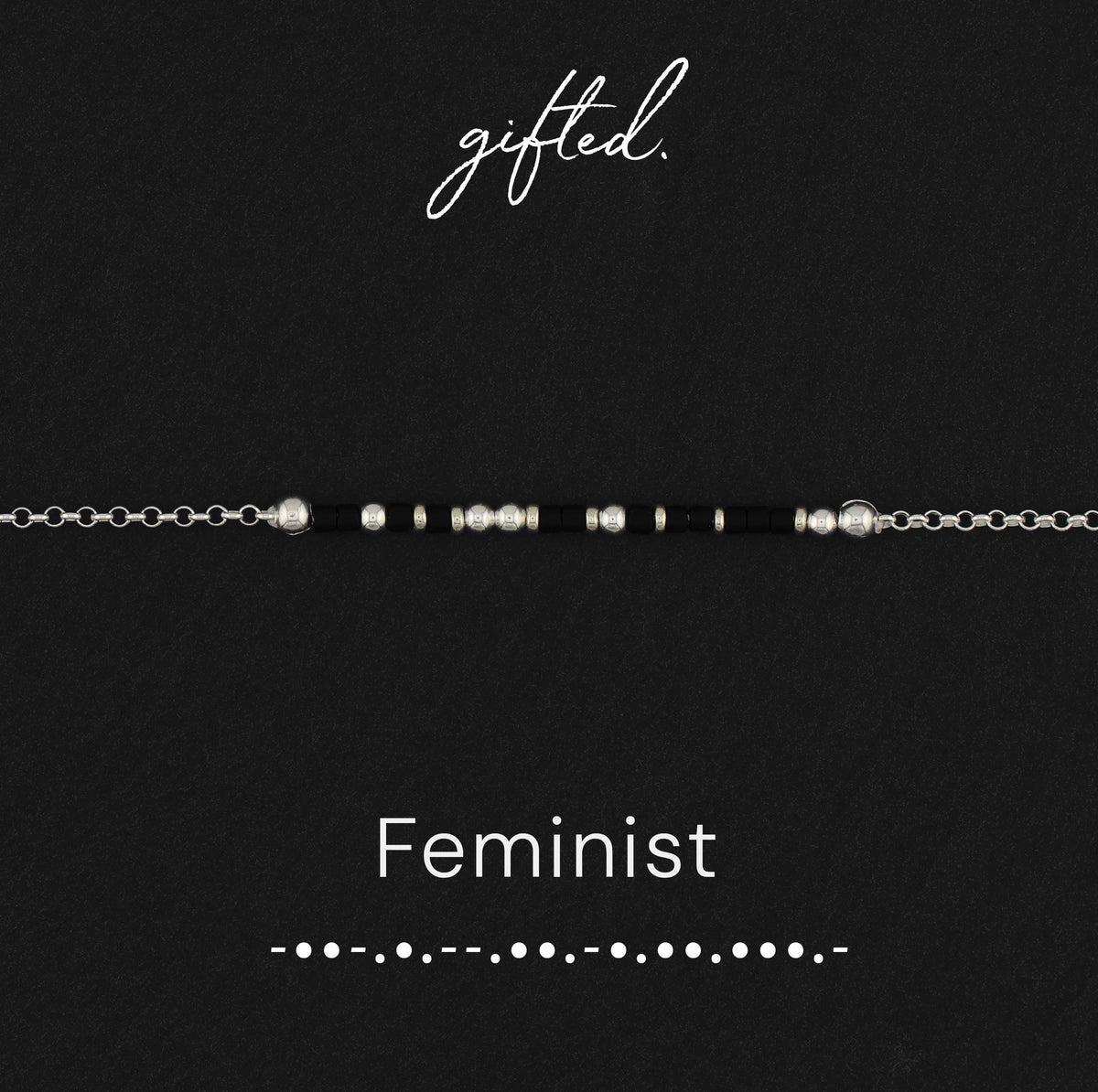 Feminist spelled in Morse code in glass and metal beads, shown on black