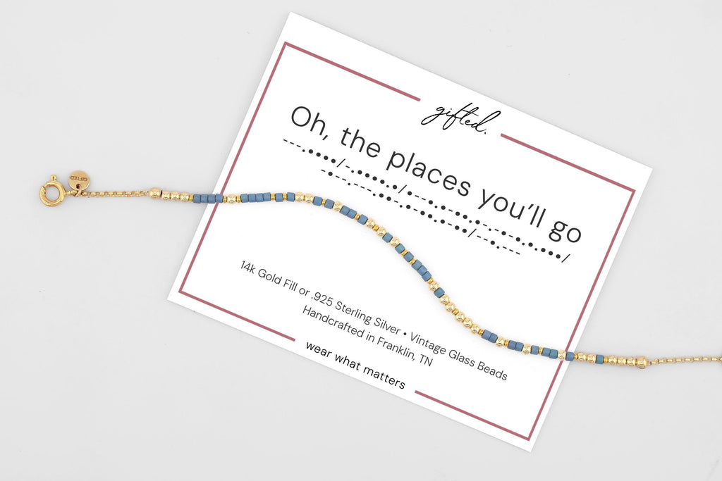 Oh the Places You'll Go spelled in Morse code on a beaded bracelet, shown on its printed gift card