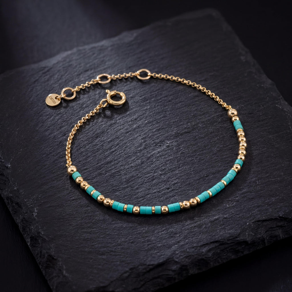 Your own phrase spelled in Morse code in glass and metal beads, shown on black