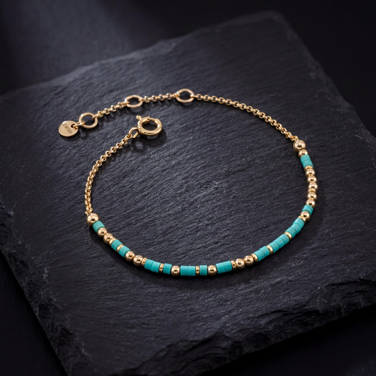 Your own phrase spelled in Morse code in glass and metal beads, shown on black