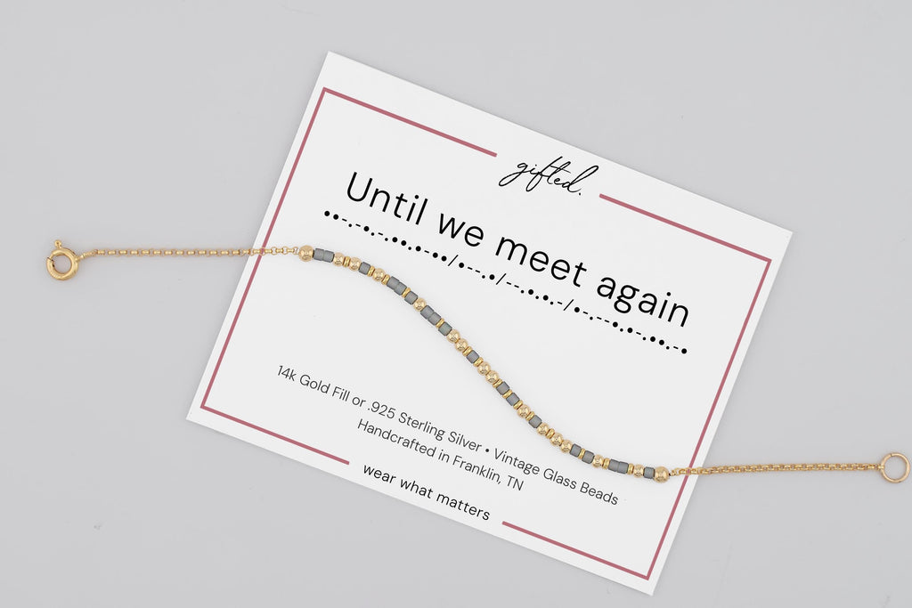 Until We Meet Again spelled in Morse code on a beaded bracelet, shown on its printed gift card