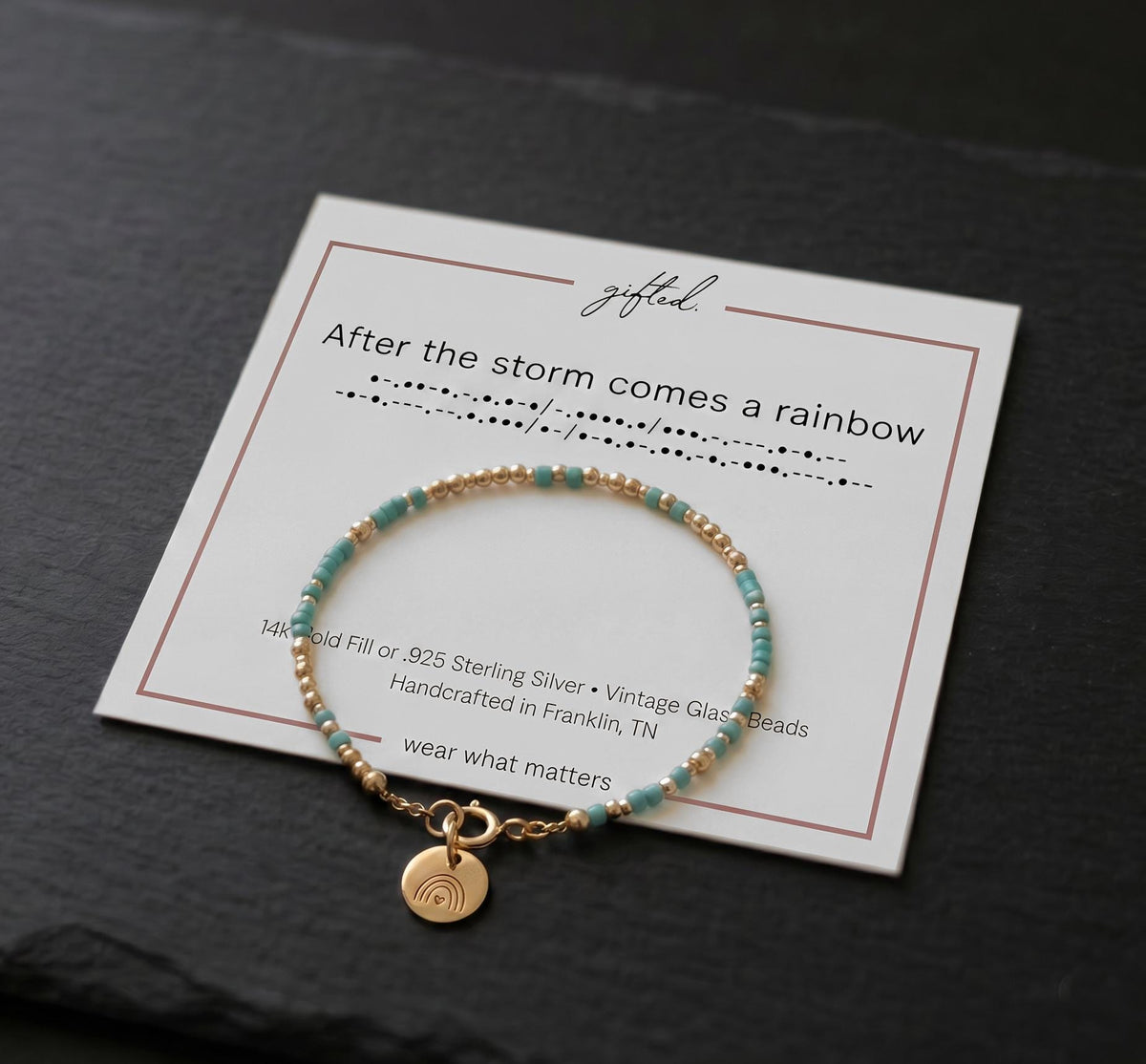 Morse code bracelet in 14k Gold Fill with turquoise beads and a rainbow charm, on the After the storm comes a rainbow card